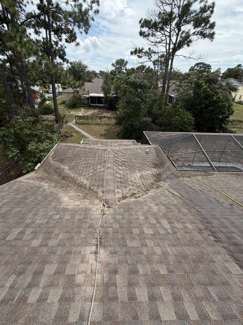The same roof valleys cleared, the shingle courses and the centre line visible all the way down